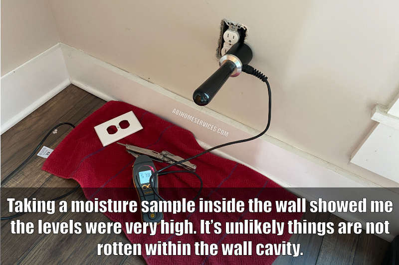 Moisture testing inside drywall for leaking stone veneer
