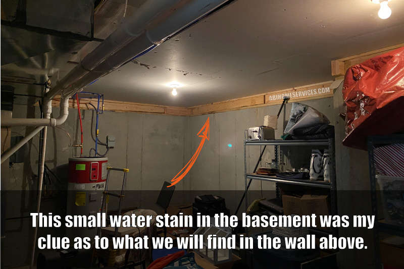 Water stains on basement walls from leaking stone veneer